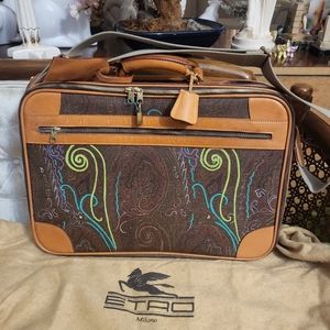 Rare Authentic vintage ETRO suitcase travel bag with guitar type strap.